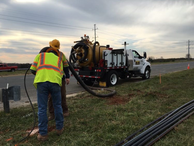 A rear action shot of the PTO - Hydro Truck Vac vacuum excavation